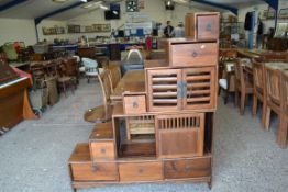 UNUSUAL FAR EASTERN STAINED PINE STORAGE CABINET OF STEPPED FORM WITH SEVEN DRAWERS AND FOUR SLATTED