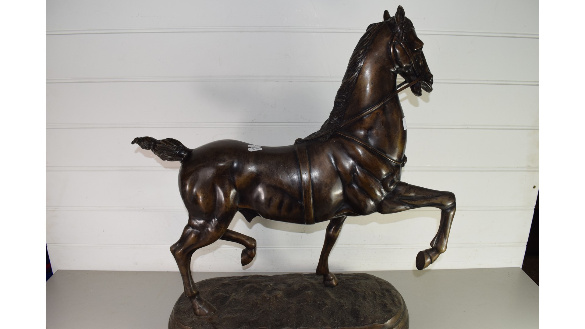 LARGE BRONZED SPELTER MODEL OF A PRANCING HORSE