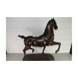 LARGE BRONZED SPELTER MODEL OF A PRANCING HORSE