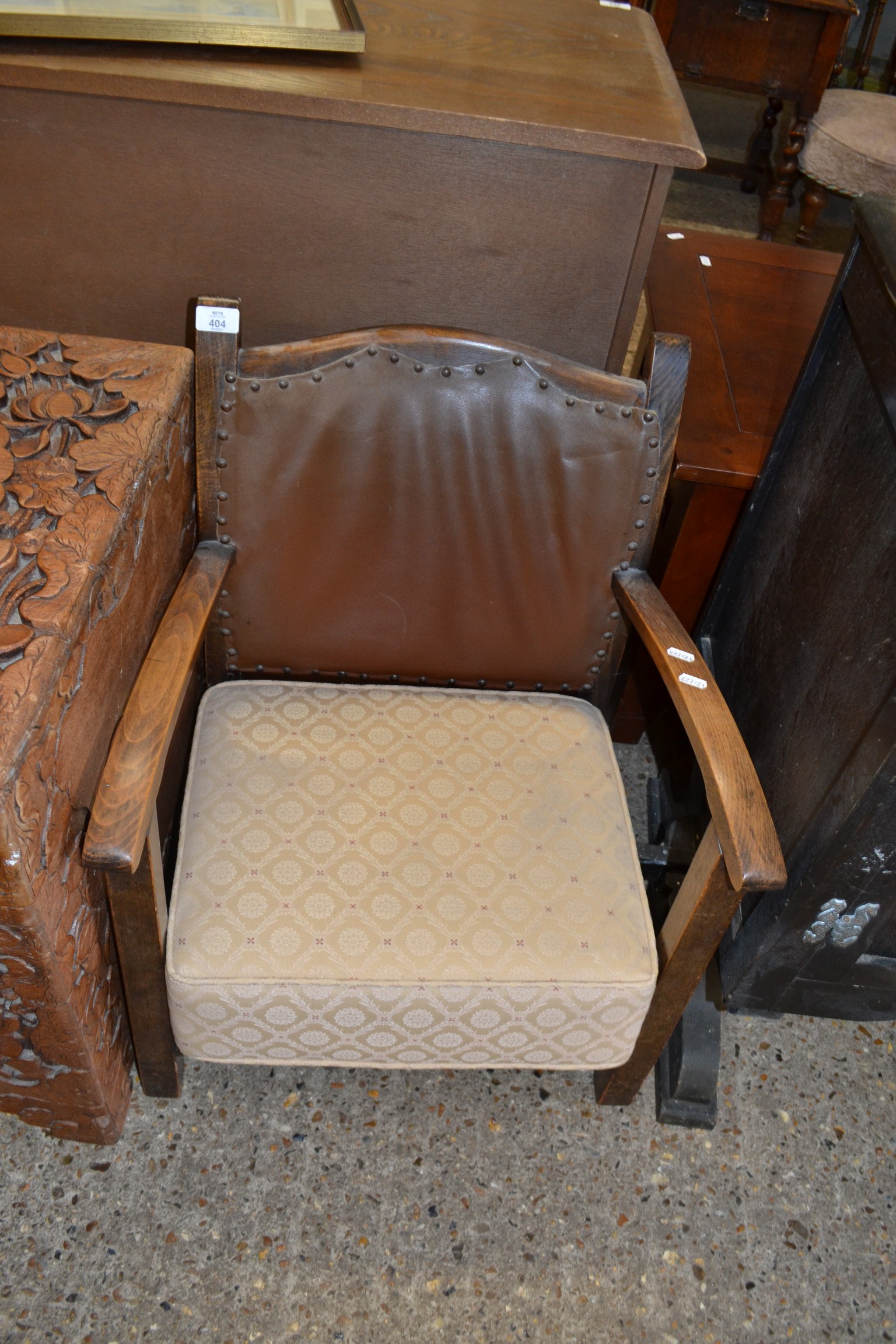 EARLY 20TH CENTURY LOW ARMCHAIR WITH LEATHER UPHOLSTERED BACK