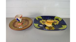 CHELSEA WORKS CLARICE CLIFF STYLE VASE, A FLORAL DECORATED MEAT PLATE AND A FURTHER HISPANIC DISH