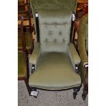 LATE VICTORIAN GREEN UPHOLSTERED ARMCHAIR WITH EBONISED FRAME