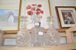 THREE ASSORTED CLEAR GLASS DECANTERS