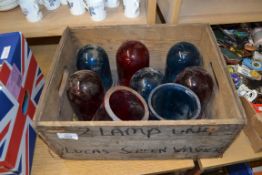 WOODEN BOX CONTAINING BLUE AND RED VINTAGE GLASS LAMP SHADES