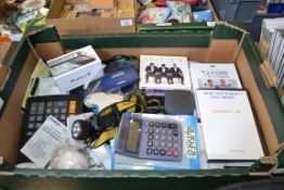 BOX OF MIXED ITEMS: CALCULATORS, DVDS, ETC