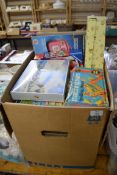 BOX OF CHILDRENS GAMES, PORCELAIN HEADED DOLL ETC