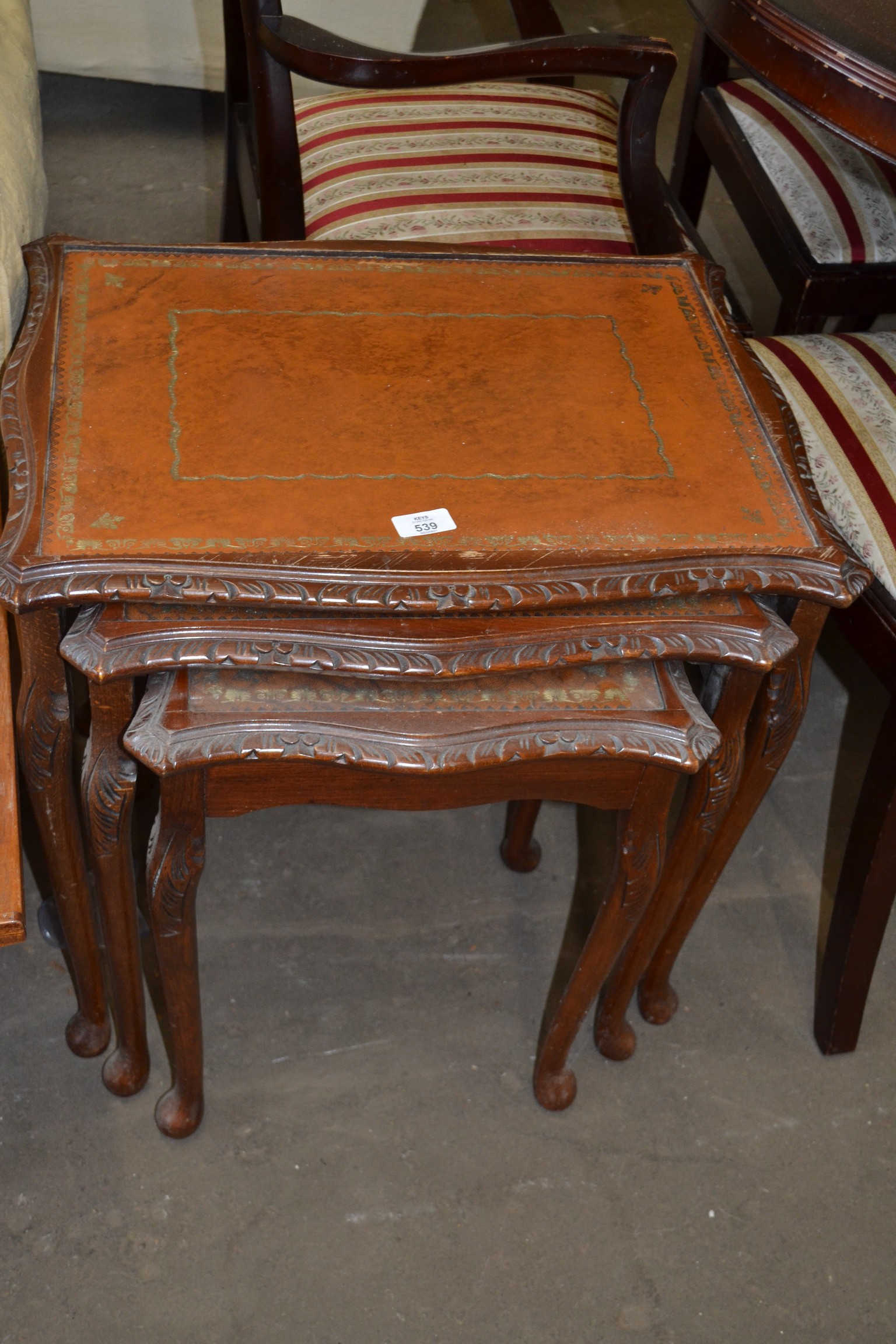 NEST OF THREE LEATHER TOPPED COFFEE TABLES, LARGEST 57CM WIDE