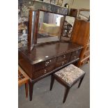 STAG MINSTREL SIX DRAWER DRESSING CHEST AND ACCOMPANYING STOOL, LARGEST PIECE 130CM WIDE