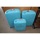 THREE HARD PLASTIC WHEELED SUITCASES