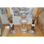 THREE SILVER METAL CANDLESTICKS