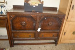 EARLY 20TH CENTURY OAK TWO-DOOR TWO-DRAWER SIDEBOARD WITH CARVED DETAIL, 122CM WIDE