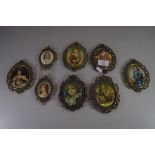 COLLECTION OF EIGHT 20TH CENTURY PRINTS ON FABRIC SET IN PIERCED BRASS FRAMES