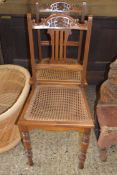 PAIR OF LATE 19TH CENTURY AMERICAN WALNUT CANE SEATED SIDE CHAIRS WITH TURNED LEGS