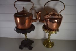 TWO COPPER KETTLES AND TWO KETTLE STANDS (4)