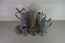 GRADUATED SET OF FOUR PEWTER JUGS PLUS A FURTHER ALUMINIUM JUG AND A PEWTER INKWELL (6)