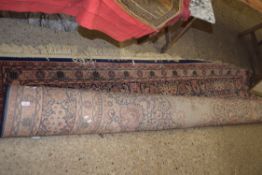 LARGE 20TH CENTURY WOOL FLOOR RUG DECORATED WITH CENTRAL MEDALLION ON A PRINCIPALLY BLUE AND RED