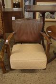 EARLY 20TH CENTURY LOW ARMCHAIR WITH LEATHER UPHOLSTERED BACK