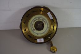 ANEROID BAROMETER IN A CASE DECORATED WITH SIGNS OF THE ZODIAC