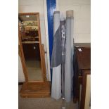 ROLLS OF FABRIC TOGETHER WITH A CLEAR CURTAIN POLE