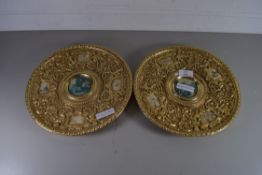 PAIR OF GILT METAL WALL PLATES WITH ELABORATE DECORATION