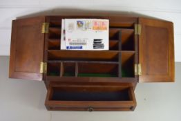 20TH CENTURY HARDWOOD WEDGE FORMED STATIONERY CABINET WITH DOUBLE HINGED DOORS