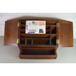 20TH CENTURY HARDWOOD WEDGE FORMED STATIONERY CABINET WITH DOUBLE HINGED DOORS