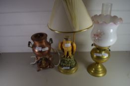 SMALL COPPER TEA URN, A BRASS OIL LAMP AND A BRASS TABLE LAMP WITH RESIN EAGLE DECORATION