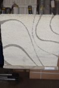 Bloomsbury Market shaggy cream rug, 99 x 152cm. RRP £88.99