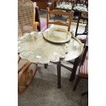 FOLDING BRASS BENARES TABLE TOGETHER WITH TWO FURTHER BRASS SERVING TRAYS