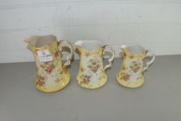 GRADUATED SET OF THREE FLORAL PATTERNED JUGS