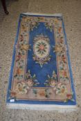 CHINESE FLORAL DECORATED WOOL RUG, 150CM LONG