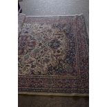 20TH CENTURY WOOL FLOOR RUG DECORATED WITH A LARGE CENTRAL PANEL WITH FLORAL DETAIL ON A PALE