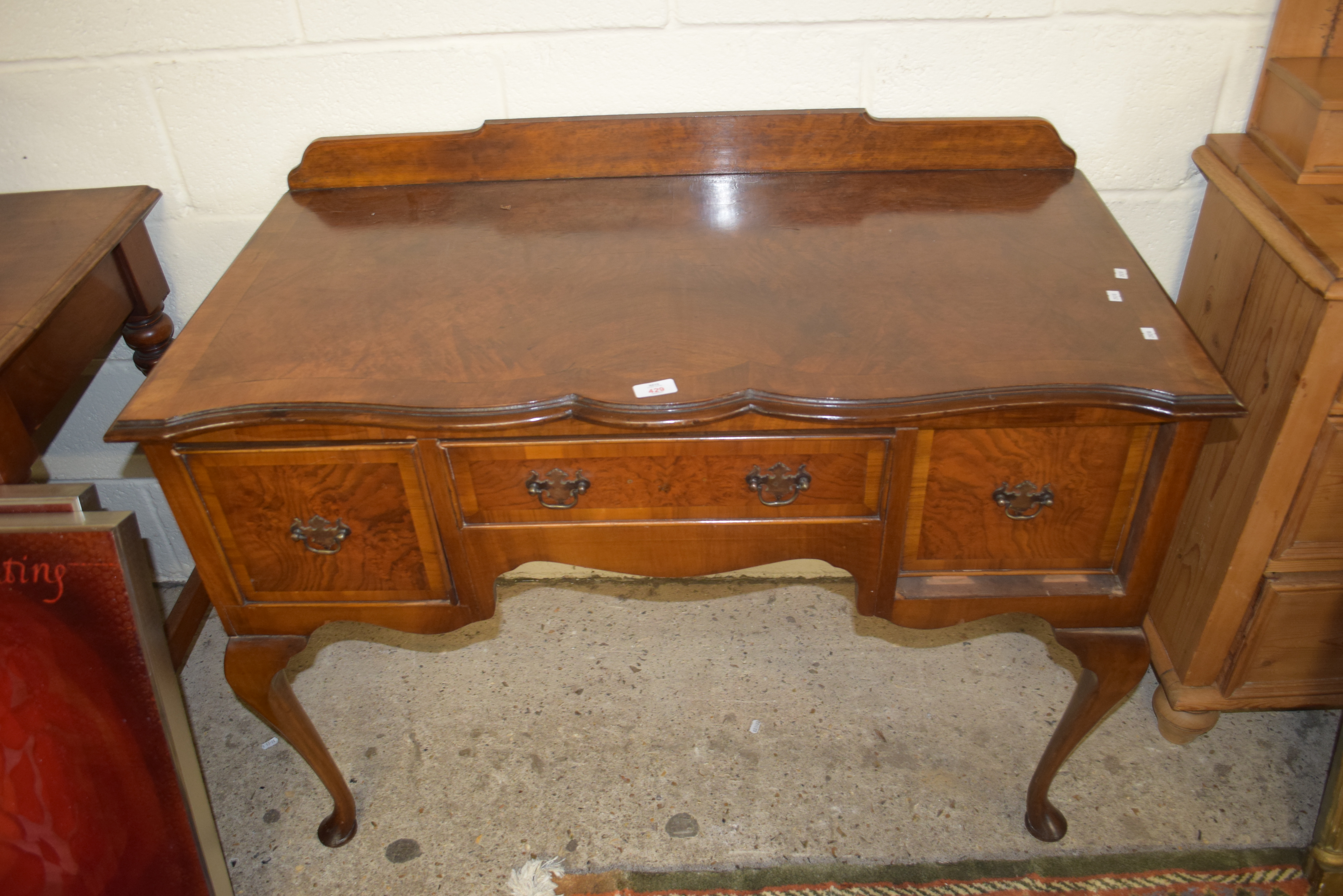 REPRODUCTION WALNUT VENEERED LOWBOY TYPE SIDE TABLE RAISED ON CABRIOLE LEGS FITTED WITH ONE