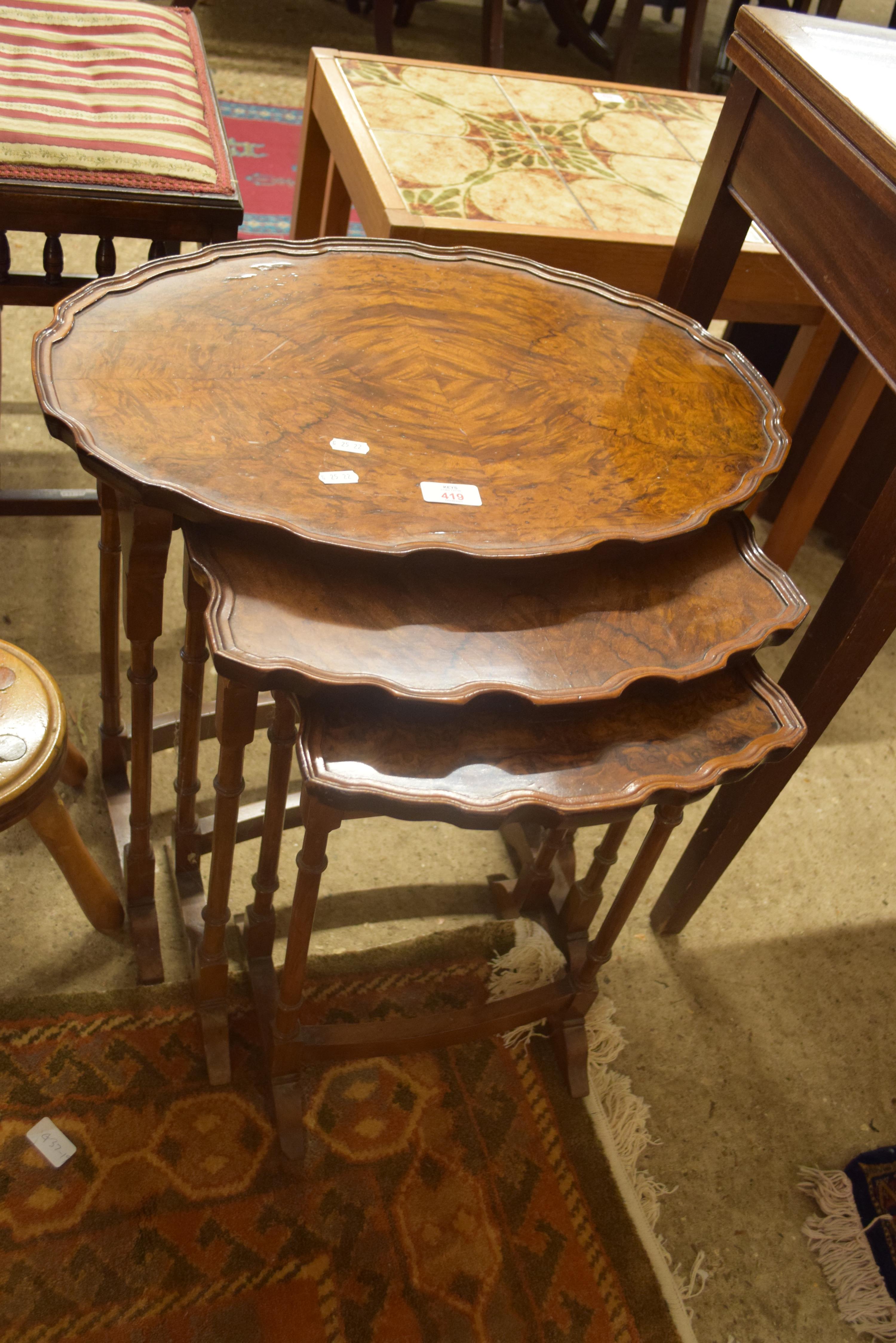 NEST OF THREE EARLY 20TH CENTURY WALNUT VENEERED OCCASIONAL TABLES, 56CM WIDE