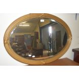 OVAL BEVELLED WALL MIRROR SET IN GILT FINISH REEDED FRAME, 85CM WIDE