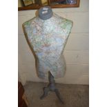 TAILOR'S MANNEQUIN COVERED IN MAP PAPER