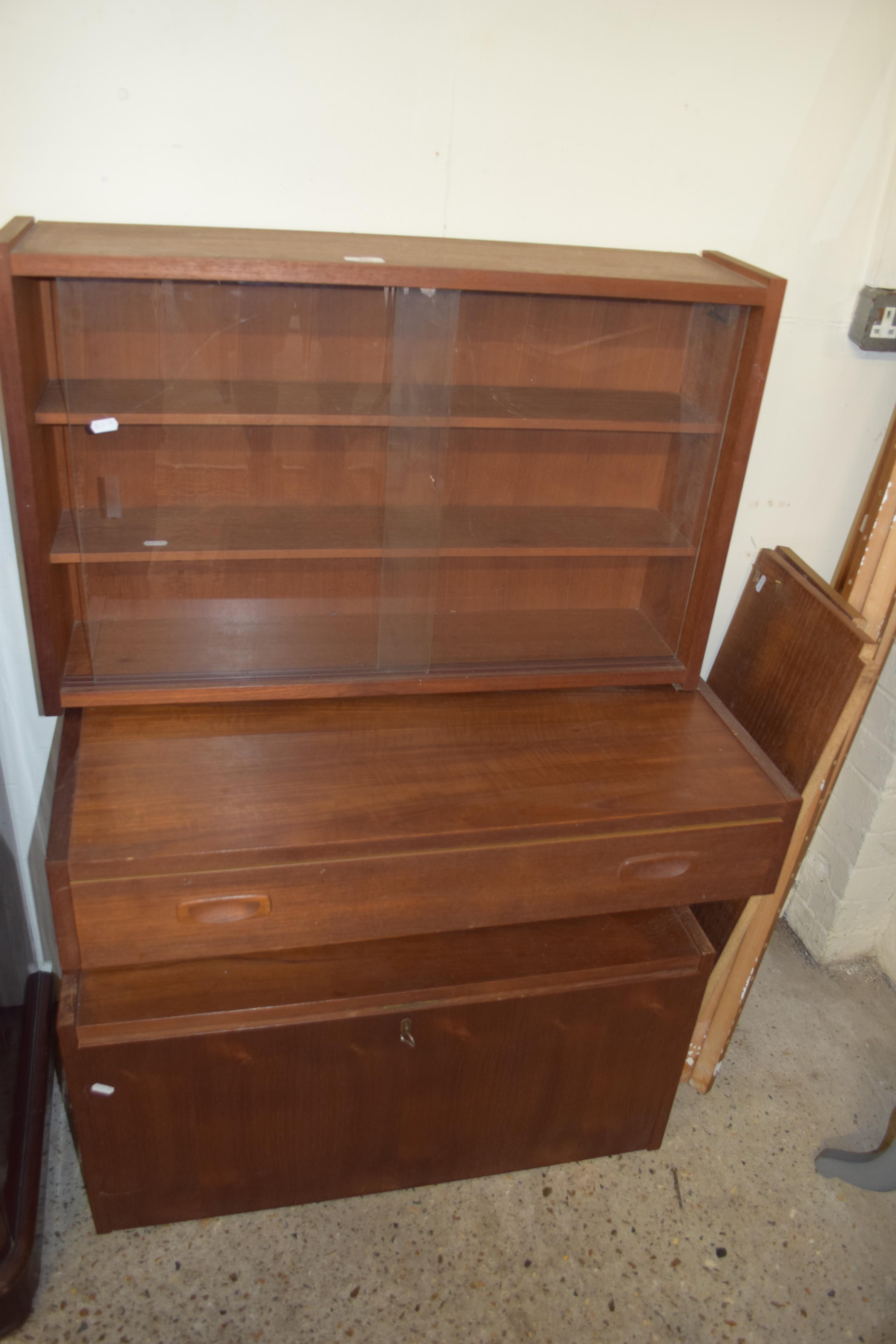 RETRO TEAK LADDERACK STYLE CABINET WITH GLAZED SECTION, SECRETAIRE SECTION AND A DRAWER, CURRENTLY