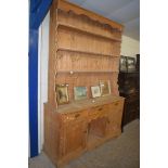 LARGE PINE DOG KENNEL STYLE DRESSER, THE BACK WITH THREE SHELVES OVER A BASE WITH THREE DRAWERS, TWO