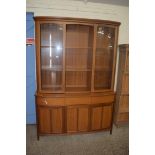 NATHAN TEAK LOUNGE DISPLAY CABINET, THE TOP SECTION WITH GLAZED DOORS OVER A BASE WITH THREE DRAWERS