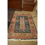 20TH CENTURY MIDDLE EASTERN WOOL FLOOR RUG DECORATED WITH STYLISED BIRDS AND ANIMALS, 180CM LONG