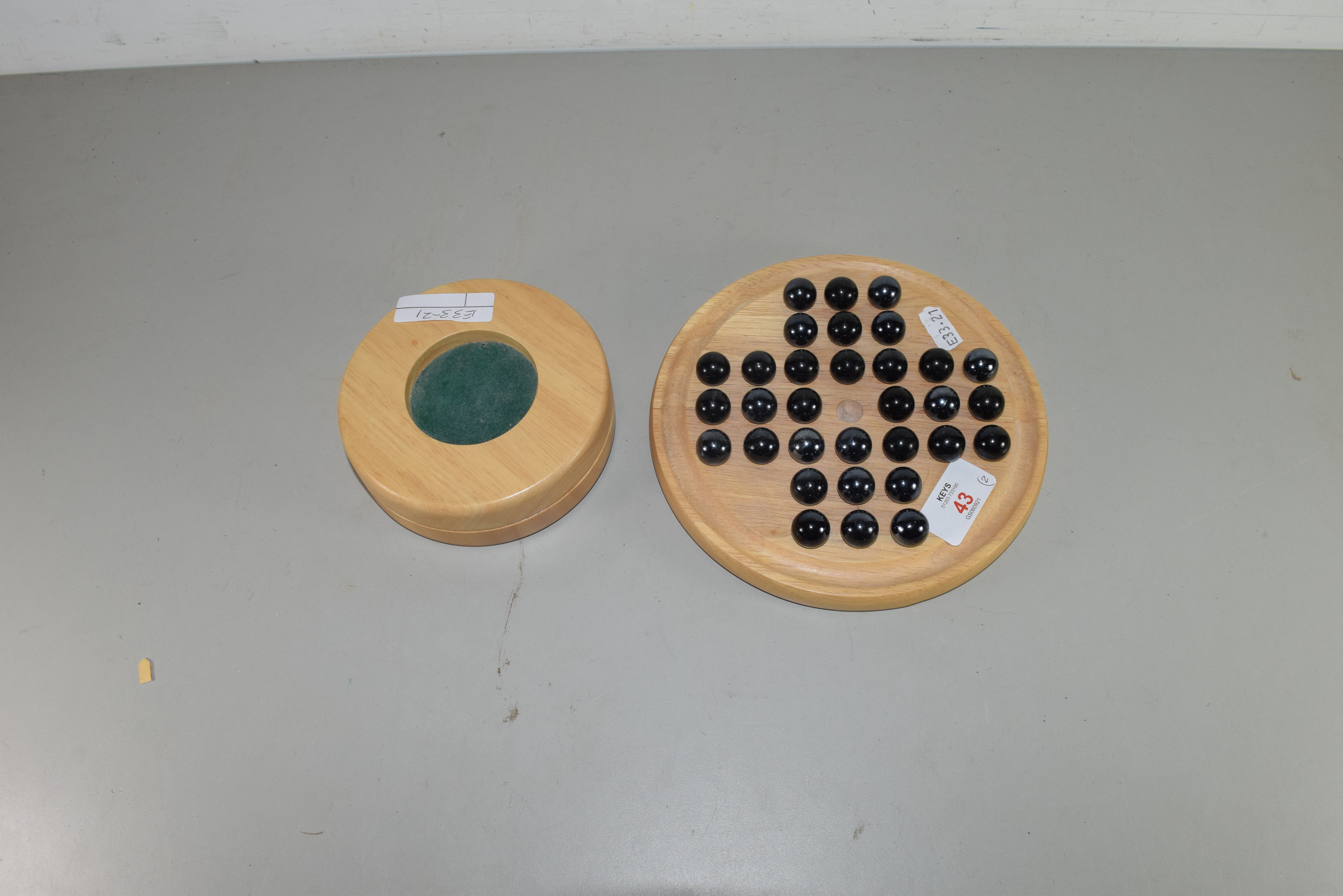 MODERN SOLITAIRE BOARD AND MARBLES, TOGETHER WITH A TIDDLYWINKS GAME