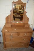 PINE DRESSING CHEST WITH MIRRORED BACK OVER A BODY WITH FOUR SMALL DRAWERS AND TWO LONG DRAWERS,