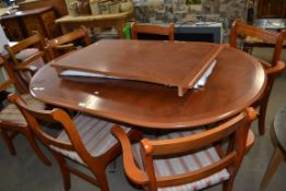 YEW WOOD TWIN PEDESTAL EXTENDING DINING TABLE AND SIX ACCOMPANYING CHAIRS