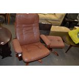LEATHER UPHOLSTERED REVOLVING CHAIR AND ACCOMPANYING FOOT STOOL