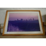 COLOURED PHOTOGRAPHIC PRINT OF FIGURES IN A MARSHLAND SETTING, FRAMED AND GLAZED