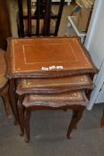 NEST OF THREE LEATHER TOPPED COFFEE TABLES, LARGEST 57CM WIDE