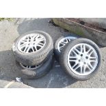 FOUR ALLOY WHEELS FOR A FORD MOTOR CAR