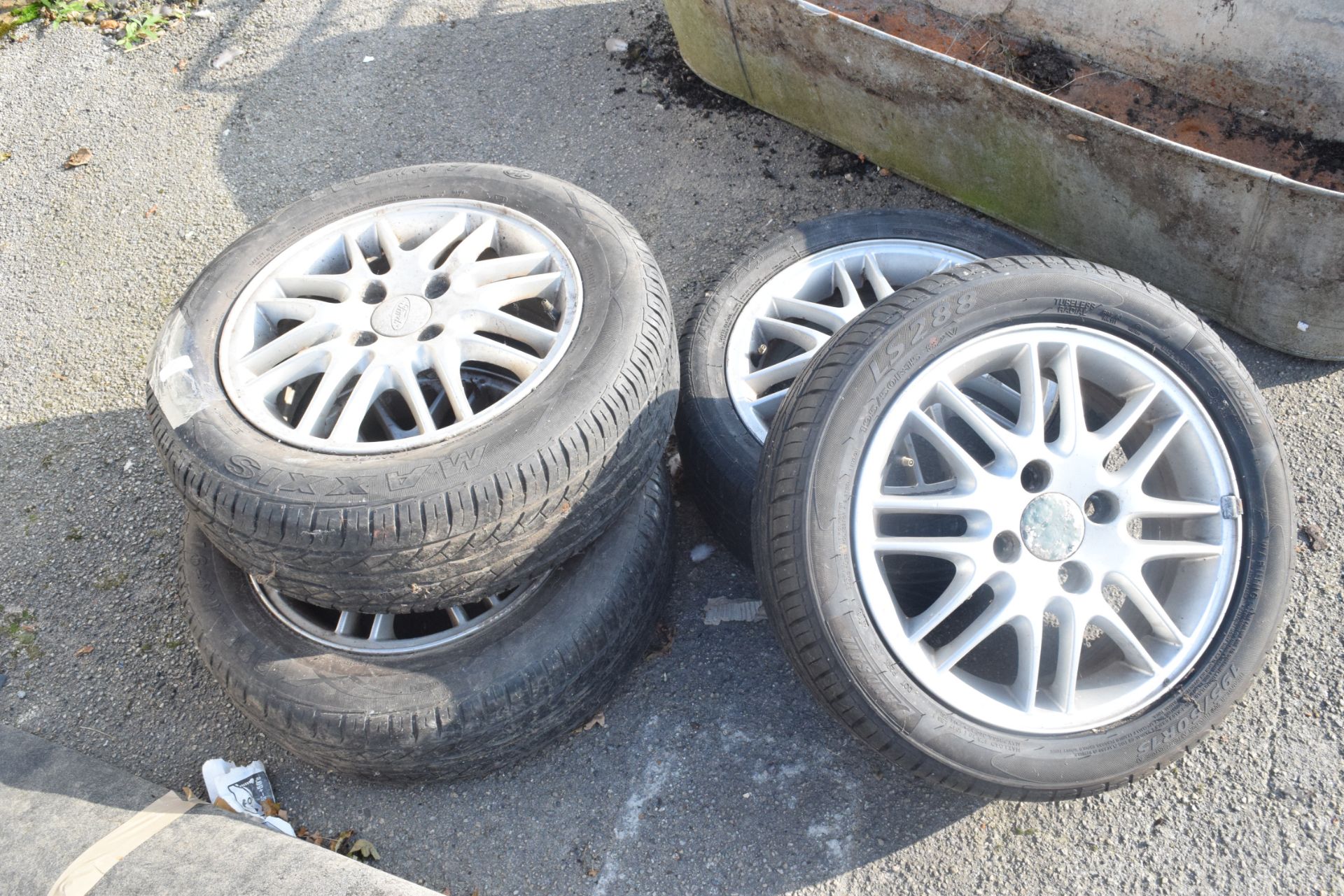 FOUR ALLOY WHEELS FOR A FORD MOTOR CAR