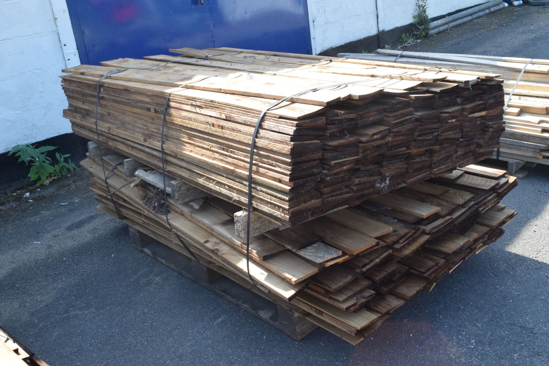 TWO PALLETS OF FEATHER EDGE FENCING BOARD