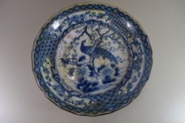 JAPANESE ARITA TYPE BOWL DECORATED WITH A CENTRAL PEACOCK